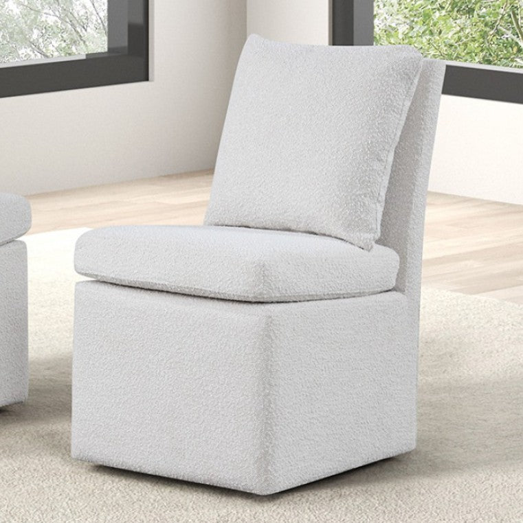 Maeve White Contemporary Modern Style Dining Chair A light gray bouclé upholstered accent chair with a square base, rounded seat cushion, and matching square back cushion, shown in a bright room with wood flooring and windows.
