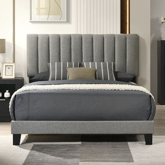Maltari Contemporary Fully Upholstered Fabric Bed Gray upholstered bed in a bedroom setting with a headboard and pillows.