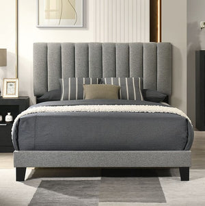 Maltari Contemporary Fully Upholstered Fabric Bed Gray upholstered bed in a bedroom setting with a headboard and pillows.