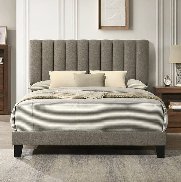 Maltari Contemporary Fully Upholstered Walnut Fabric Bed Gray upholstered bed with striped bedding in a bedroom setting.