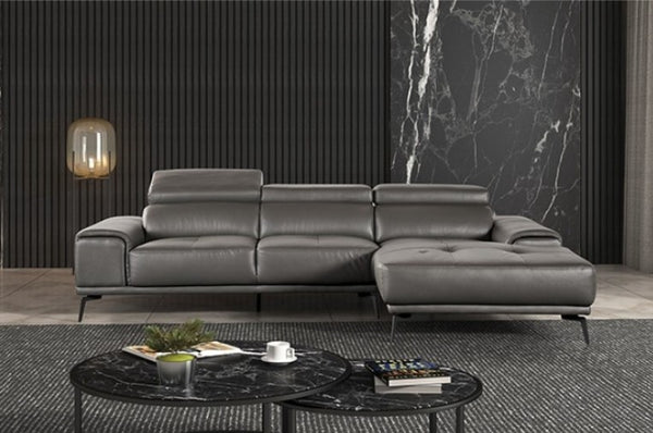 Matteo Modern Style Dark Gray Adjustable Headrest Leather Sectional Sofa Gray leather sectional sofa in a modern living room with marble coffee table and wall.