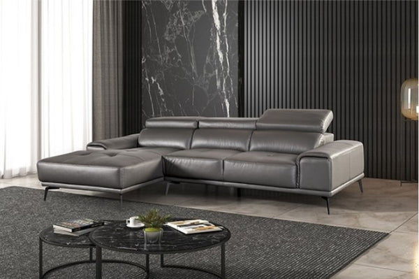 Matteo Modern Style Dark Gray Adjustable Headrest Leather Sectional Sofa Gray leather sectional sofa in a modern living room with a marble accent wall.