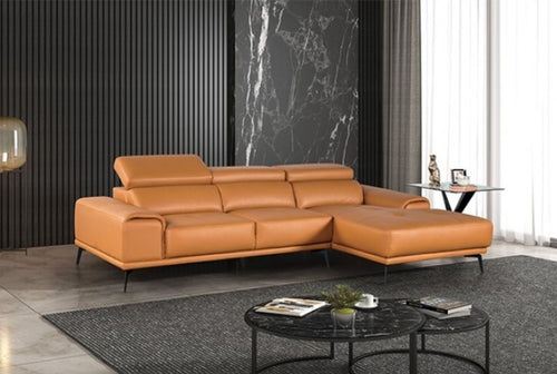 Matteo Modern Style Tangerine Adjustable Headrest Leather Sectional Sofa Brown leather sectional sofa in a modern living room with a marble wall and glass coffee table.