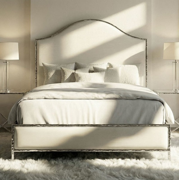 Melan Fabric Chrome Metal Two Tone Bed Neatly made bed with decorative pillows in a bedroom setting