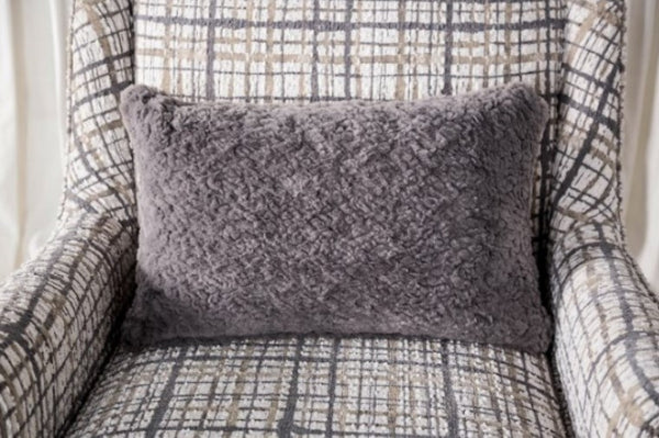 Mercia Sloped Track Arm Accent Chair Gray textured pillow on a patterned armchair