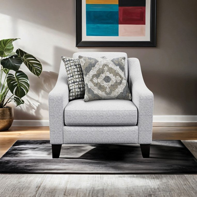 Mercia Sloped Track Arm Chair Gray armchair with patterned cushions in a living room setting
