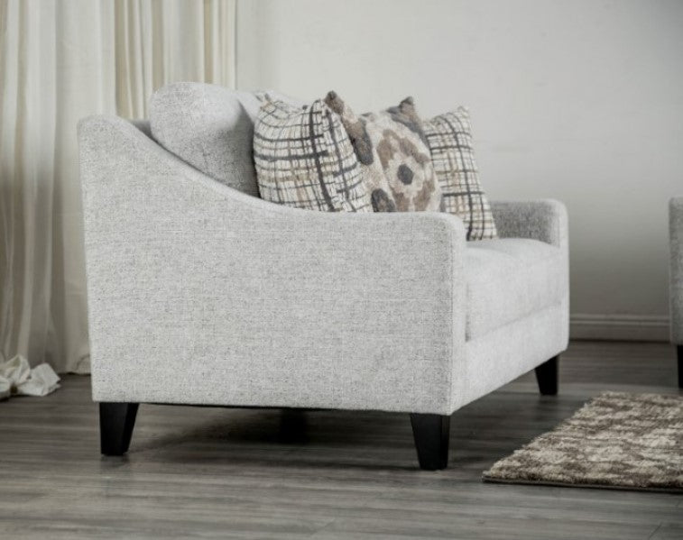 Mercia Sloped Track Arm Loveseat 
Gray Loveseat with patterned cushions in a living room setting