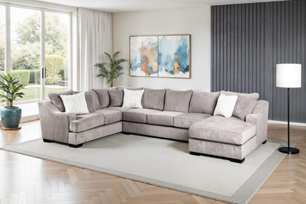 Mika Oversized Transitional Style Sectional Sofa Gray sectional sofa in a living room with abstract art on the wall.