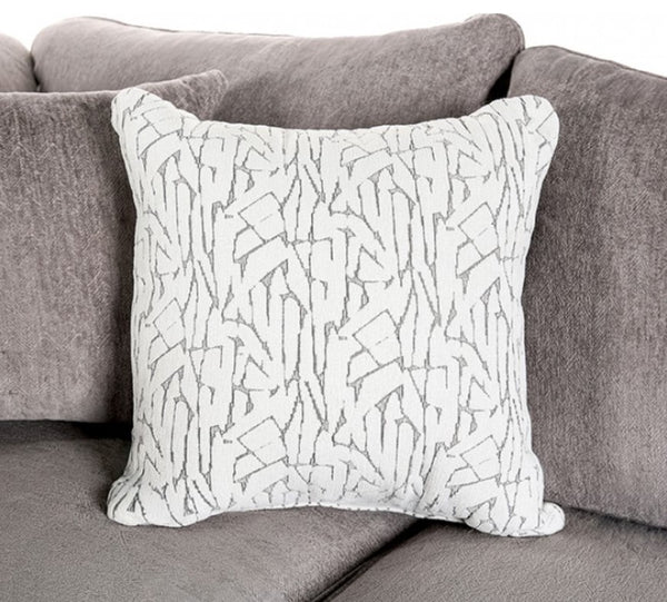Mika Oversized Transitional Style Sofa Decorative pillow with abstract pattern on a gray sofa