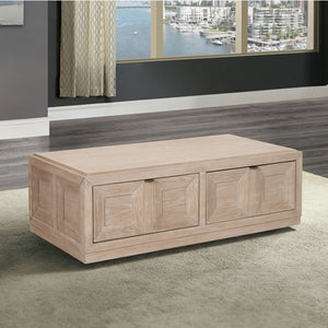 Montague Cross Modern Style Tawny Coffee Table A light natural wood storage bench with three front drawers, shown in a modern living room setting with a window overlooking water and boats.