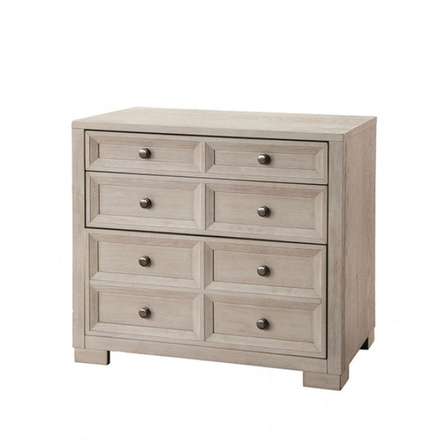 Montague Cross Modern Classic Tawny Credenza A six-drawer wooden dresser in a light grayish-brown finish with small round dark metal knobs, shown on a plain white background.