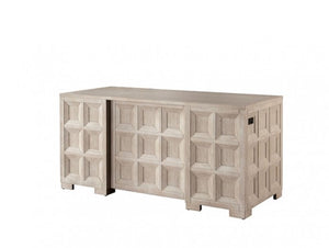 Montague Cross Modern Classic Tawny Executive Desk A light beige wood chest of drawers with a geometric, raised panel design on the front, shown against a plain white background.