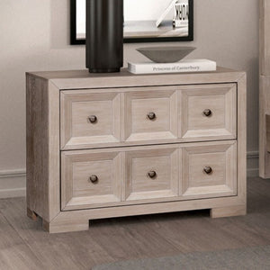 Montague Cross Modern Classic Tawny Oversized Nightstand A light gray wood dresser with six drawers and round dark knobs, shown in a styled room setting with a black vase, a book, and framed wall art on top.