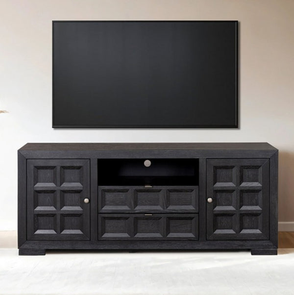 Montague Cross Modern Style Black TV Stand 72" A black wooden TV stand with decorative paneled doors and a central open shelf, shown against a beige wall with a large black television mounted above it.