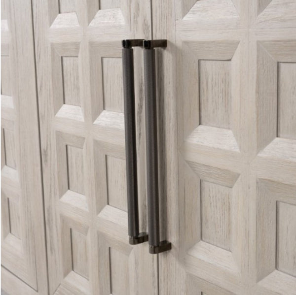 Montague Cross Modern Style Dining Server A close-up of a light wood cabinet door with a geometric raised panel design, featuring two long, dark metal bar handles mounted vertically.