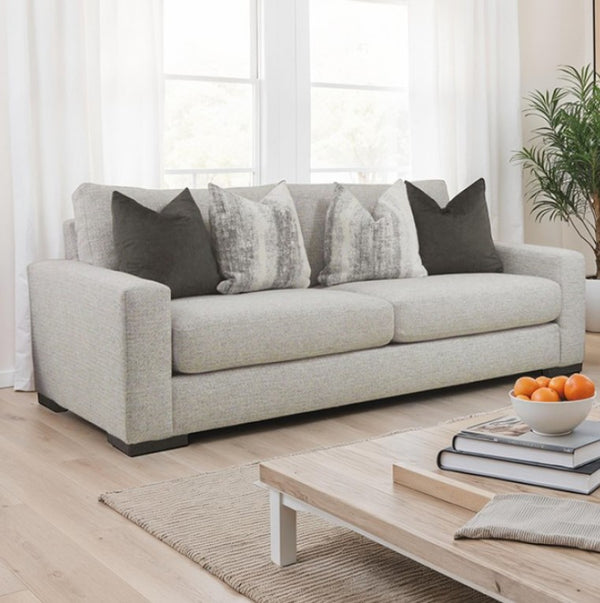 Nareen Gray Fabric Loveseat with Multicolor Pillows Gray sofa with decorative pillows in a living room setting.