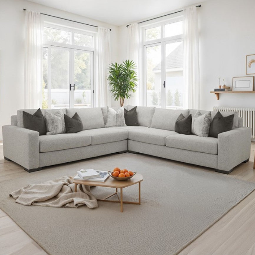 Nareen Gray Fabric Sectional Sofa with Multicolor Pillows Modern living room with a sectional sofa, coffee table, and decorative elements.