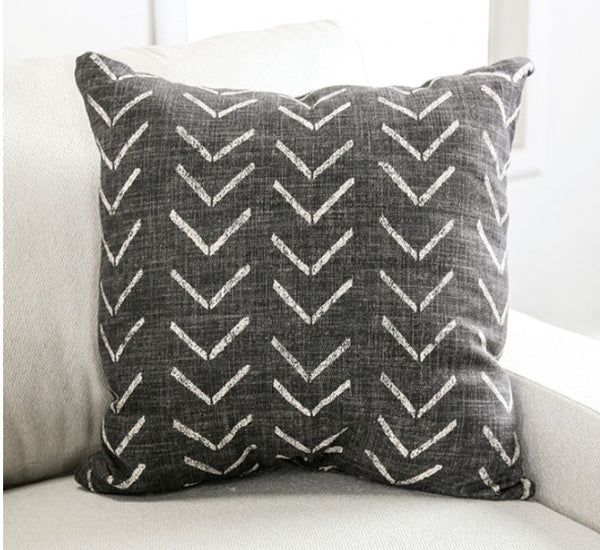 Nareen White Fabric Sectional Sofa with Multicolor Pillows Gray pillow with white zigzag pattern on a light-colored couch