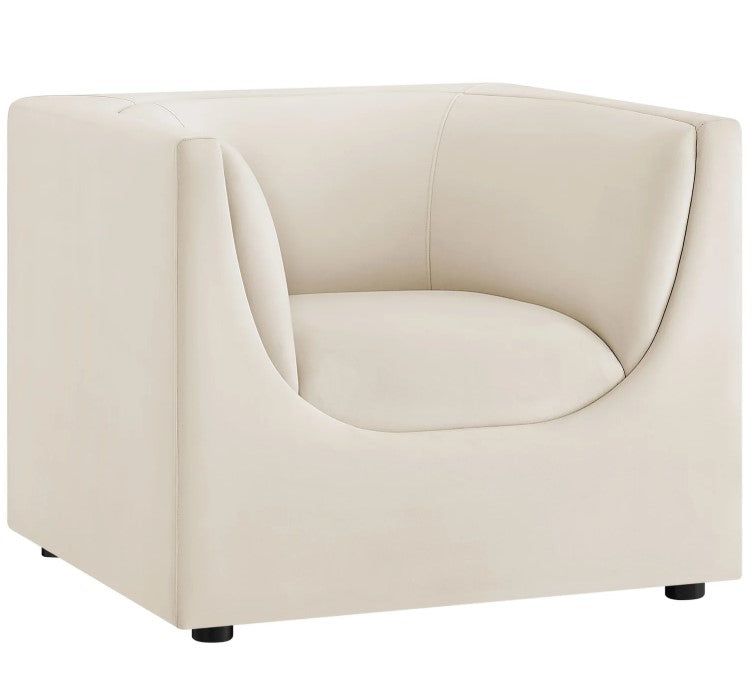 Natalia Alabaster Velvet Fabric Chair Beige armchair in a room with a large window view of greenery