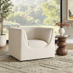 Natalia Alabaster Velvet Fabric Chair Beige armchair in a room with a large window view of greenery