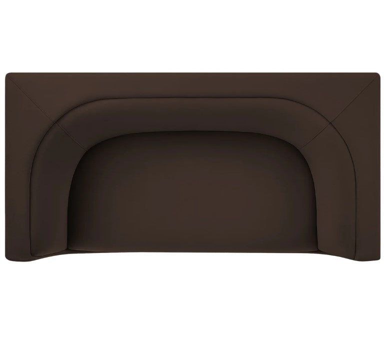 Natalia Chocolate Brown Velvet Fabric Loveseat Brown sofa with a blue pillow in a living room setting with a painting and lamp.