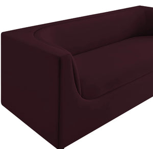 Natalia Mulberry Velvet Fabric Sofa Dark red sofa on a white background
