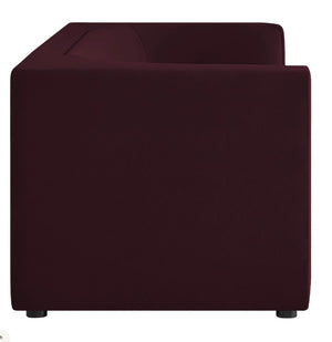 Natalia Mulberry Velvet Fabric Sofa Maroon cube-shaped ottoman on a white background