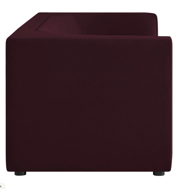 Natalia Mulberry Velvet Fabric Sofa Maroon cube-shaped ottoman on a white background
