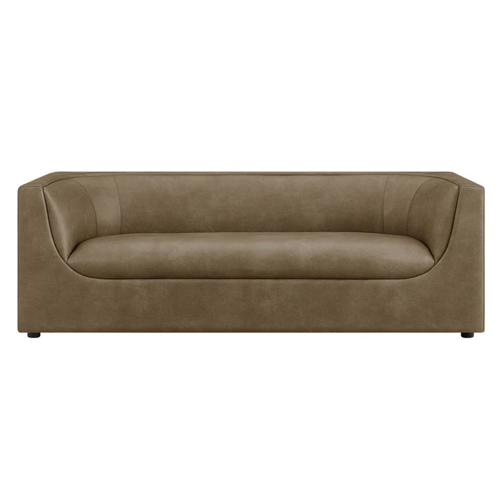 Natalia Premium Vegan Leather Sofa Beige sofa in a living room with a painting on the wall and a lamp.