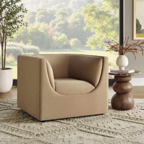 Natalia Taupe Velvet Fabric Chair Beige armchair in a room with a large window view of greenery