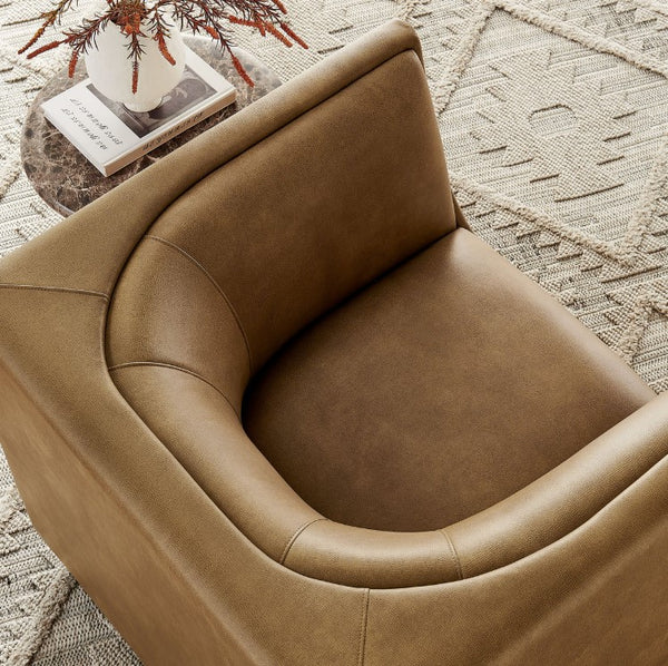 Natalia Toast Premium Vegan Leather Chair Brown leather armchair in a room with a textured rug and decorative items.