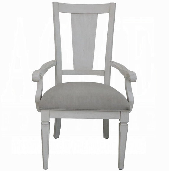 A light gray upholstered armchair with a tall slatted backrest and turned legs, shown against a plain white background.