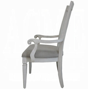 A classic high-back armchair with a distressed white painted frame and a light gray upholstered seat cushion, shown from a side profile view against a white background.