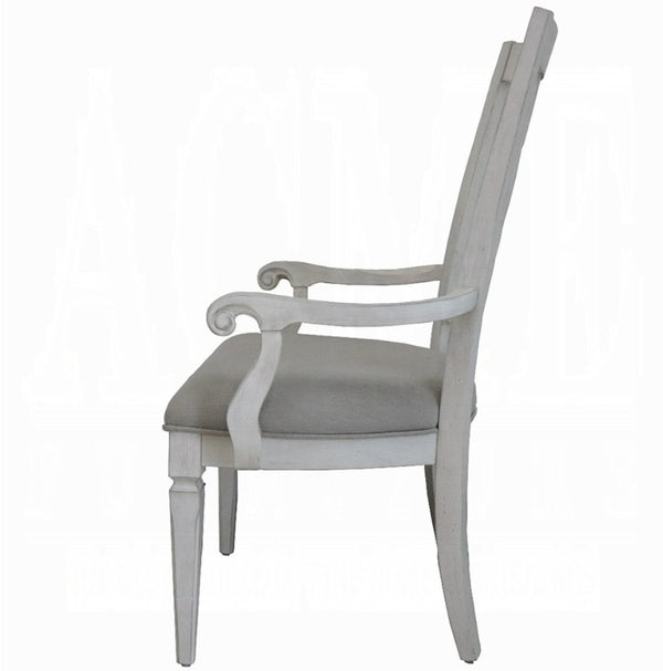 A classic high-back armchair with a distressed white painted frame and a light gray upholstered seat cushion, shown from a side profile view against a white background.