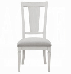 A single dining chair with a white painted wooden frame and a light beige textured fabric seat cushion, shown from a front-facing perspective on a white background.
