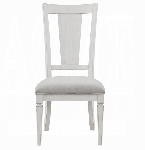 A single dining chair with a white painted wooden frame and a light beige textured fabric seat cushion, shown from a front-facing perspective on a white background.