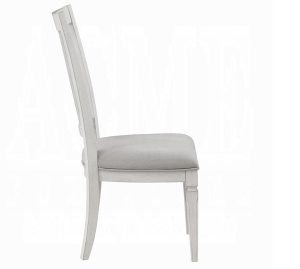 A light gray upholstered dining chair with a tall slatted backrest, shown from the side against a plain white background.