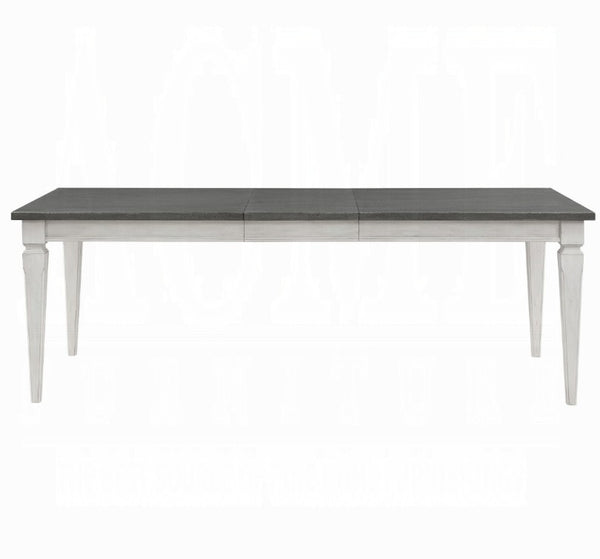A rectangular dining table with a dark gray wood-look top and a white painted frame and legs, shown against a plain white background.