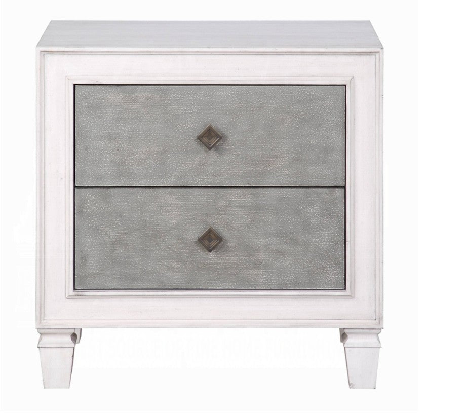 Natasha Two Tone Light Gray Nightstand A white two-drawer nightstand with textured gray drawer fronts and small dark diamond-shaped pulls, styled in a bedroom setting with a table lamp, books, and flowers on top.