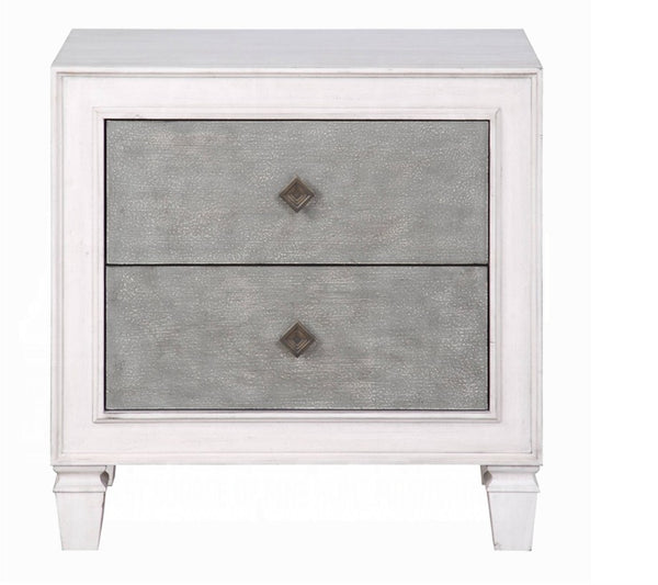 Natasha Two Tone Light Gray Nightstand A two-drawer nightstand with a white painted frame and textured gray drawer fronts, featuring small diamond-shaped metal pulls and turned legs.