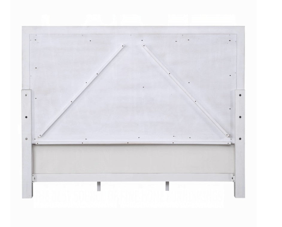 Natasha Upholstered Light Gray Linen Bedroom A bedroom furniture set in a staged room, featuring a white and gray upholstered bed frame, matching dresser, nightstand, and chest of drawers, with a gray rug and gray walls.