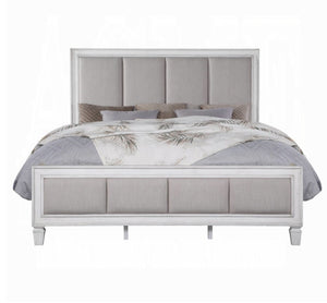Natasha Upholstered Light Gray Linen Bedroom A light gray upholstered bed frame with a tall segmented headboard and matching footboard, styled with gray and white bedding on a plain white background.