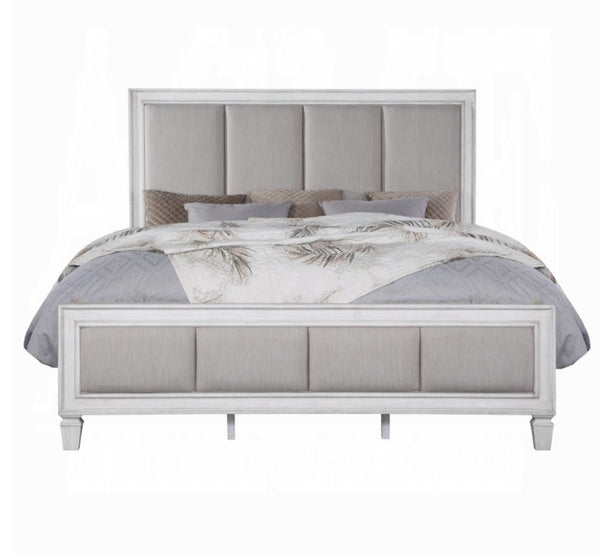 Natasha Upholstered Light Gray Linen Bedroom A light gray upholstered bed frame with a tall segmented headboard and matching footboard, styled with gray and white bedding on a plain white background.