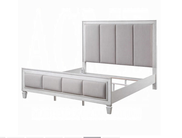 Natasha Upholstered Light Gray Linen Bedroom A modern bed frame with a tall, vertically padded upholstered headboard and matching footboard, finished in light gray fabric with a white frame.