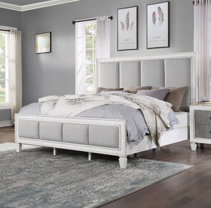 Natasha Upholstered Light Gray Linen Bedroom A white upholstered bed frame with a tall segmented headboard and matching footboard, styled in a bedroom with gray walls, neutral bedding, and a patterned area rug.