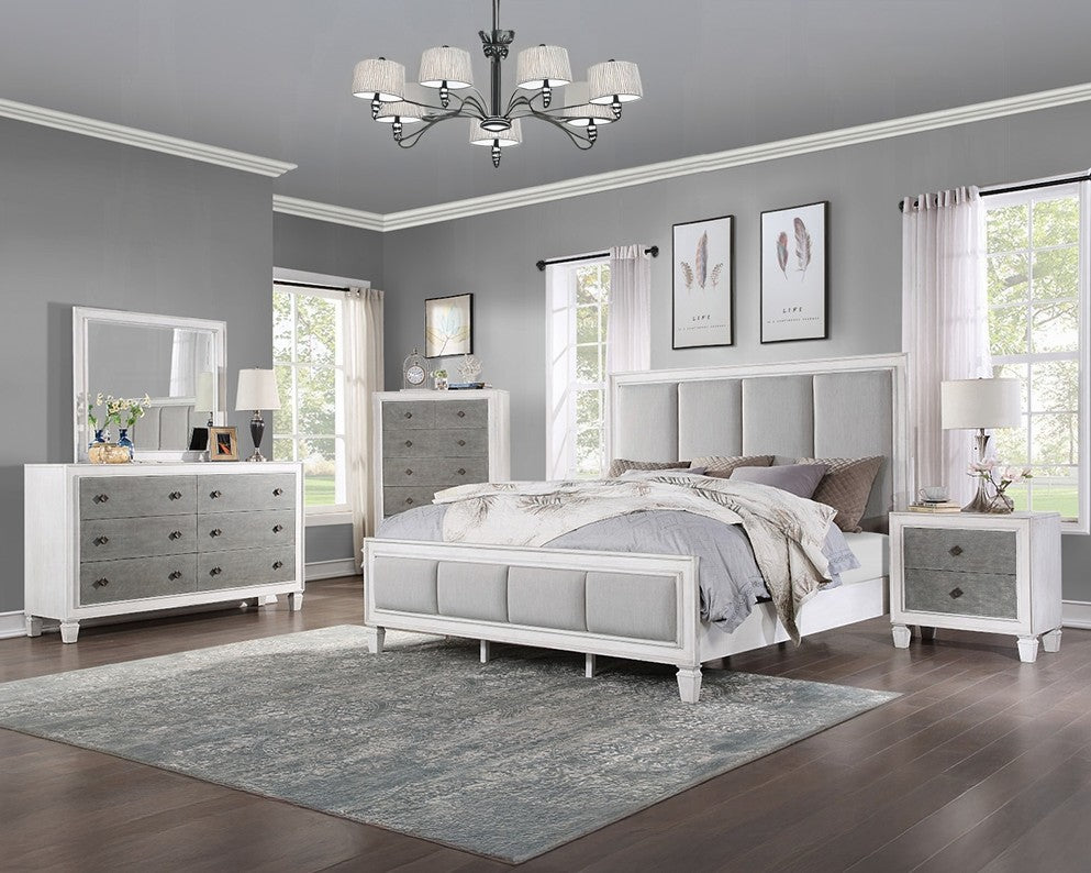 Natasha Upholstered Light Gray Linen Bedroom A bedroom furniture set in a staged room, featuring a white and gray upholstered bed frame, matching dresser, nightstand, and chest of drawers, with a gray rug and gray walls.