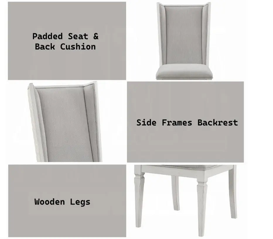 A white dining chair with a light gray upholstered seat and backrest, positioned on a gray and white patterned rug in a bright room with sheer curtains and windows.