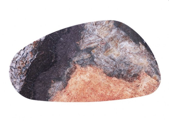 Naynem Coffee Table Oval Sintered Stone Black Gray Gold Finish An abstract-shaped coffee table with a marbled top in orange, black, and gray, supported by three cylindrical gold legs, shown in a modern living room setting.