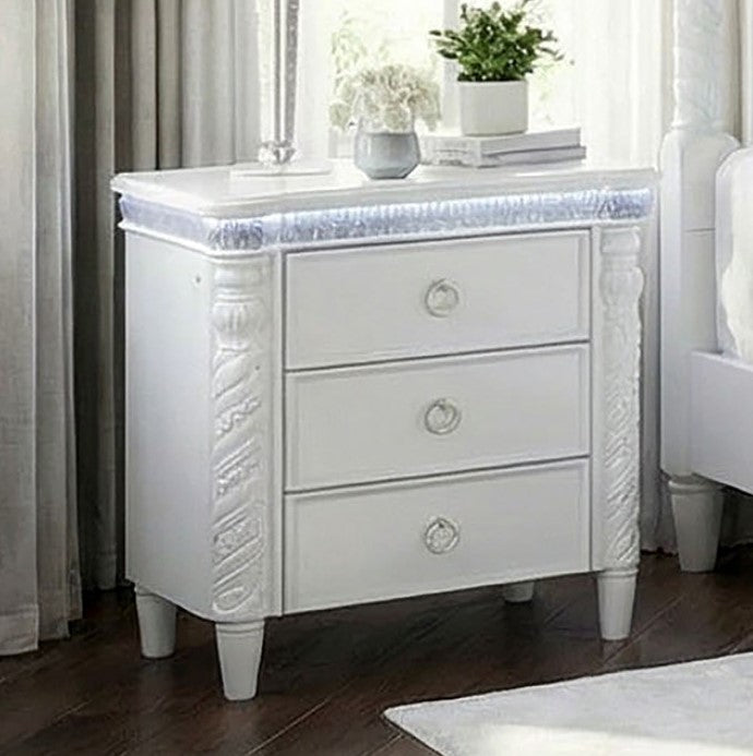Octavia Victorian Style Pearl White Nightstand White nightstand with decorative carvings in a bedroom setting