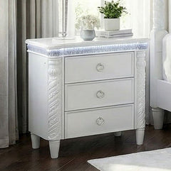 Octavia Victorian Style Pearl White Nightstand White nightstand with decorative carvings in a bedroom setting
